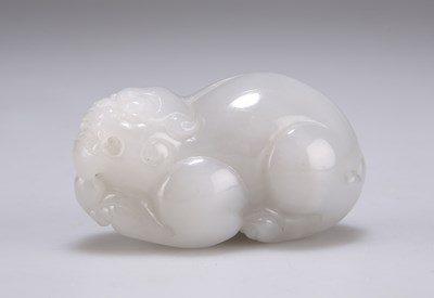 Lot 676 - A CHINESE PALE JADE CARVING OF A QILIN