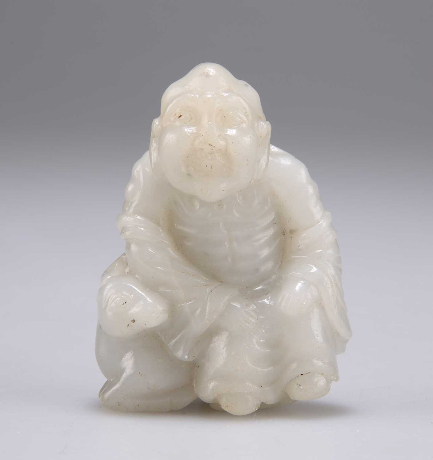 Lot 627 - A CHINESE CARVED JADE FIGURE