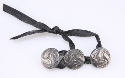 Lot 219 - ARCHIBALD KNOX (1864-1933) FOR LIBERTY & CO, THREE SILVER CYMRIC BUTTONS