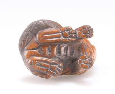 Lot 633 - A JAPANESE CARVED WOOD CAT NETSUKE