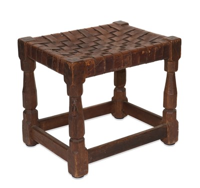 Lot 1459 - ROBERT THOMPSON OF KILBURN, AN EARLY MOUSEMAN OAK AND LEATHER STOOL, CIRCA 1930S