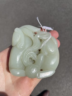 Lot 649 - A CHINESE JADE CARVING OF LION DOGS