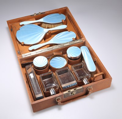 Lot 164 - AN ART DECO SILVER AND ENAMEL-MOUNTED TRAVELLING VANITY SET