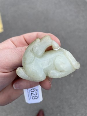 Lot 628 - A CHINESE JADE RAM CARVING