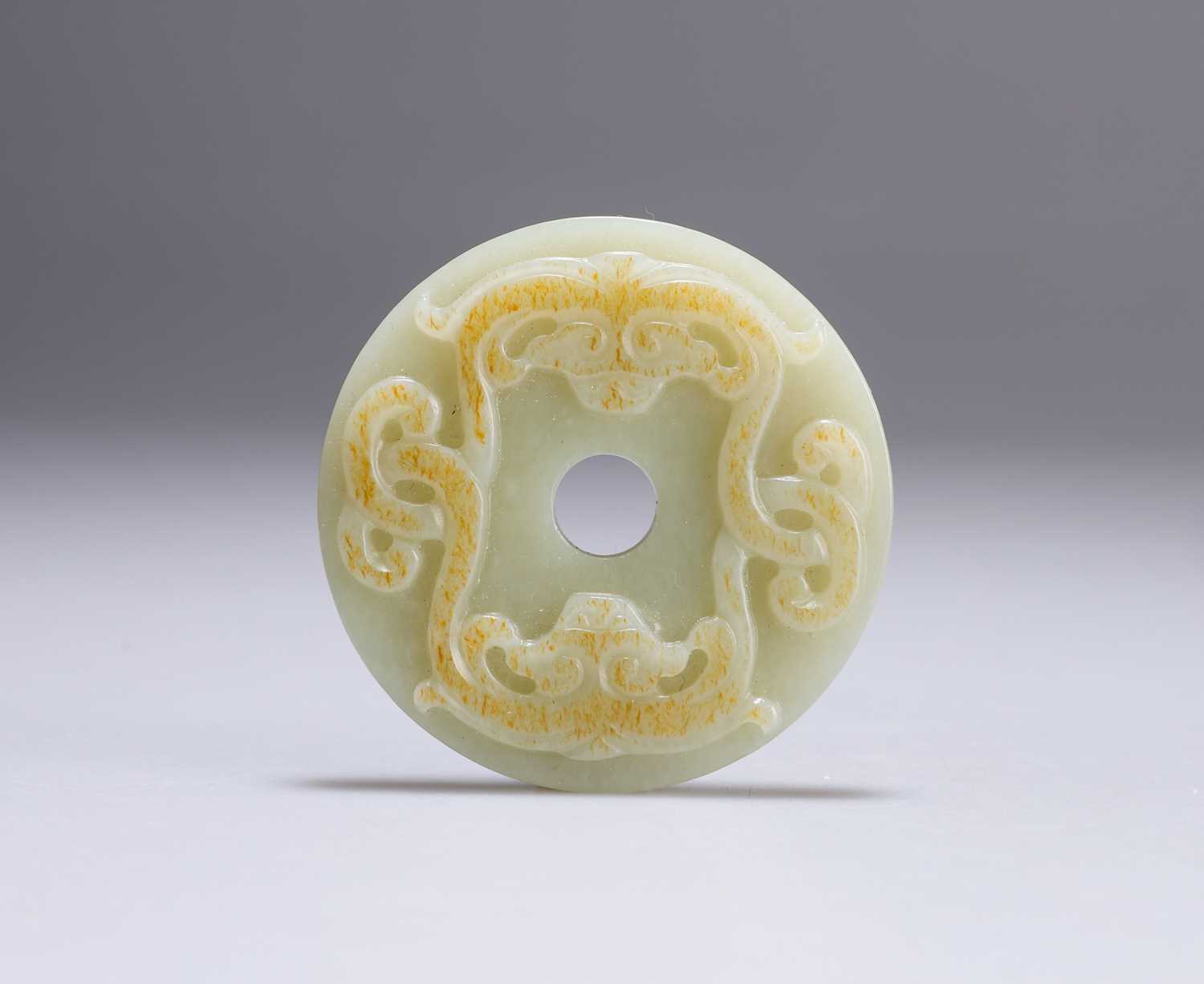 Lot 645 - A CHINESE JADE BI DISC