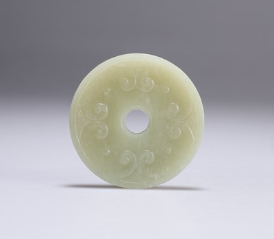 Lot 645 - A CHINESE JADE BI DISC