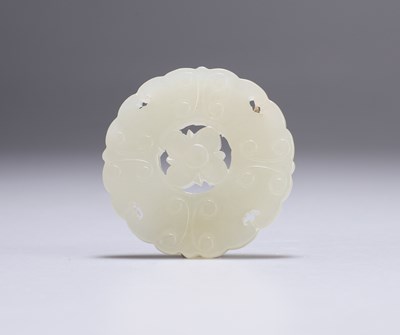 Lot 657 - A CHINESE JADE BI DISC