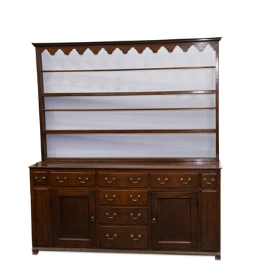 Lot 1253 - A GEORGE III OAK DRESSER AND RACK