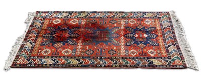 Lot 699 - A CAUCASIAN RUG